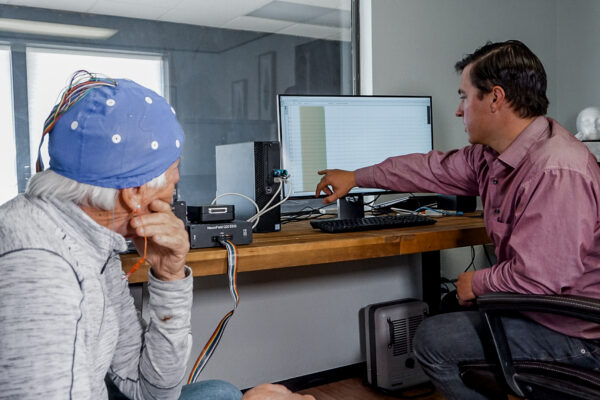 EEG Brain Mapping with coaching client looking at brain waves